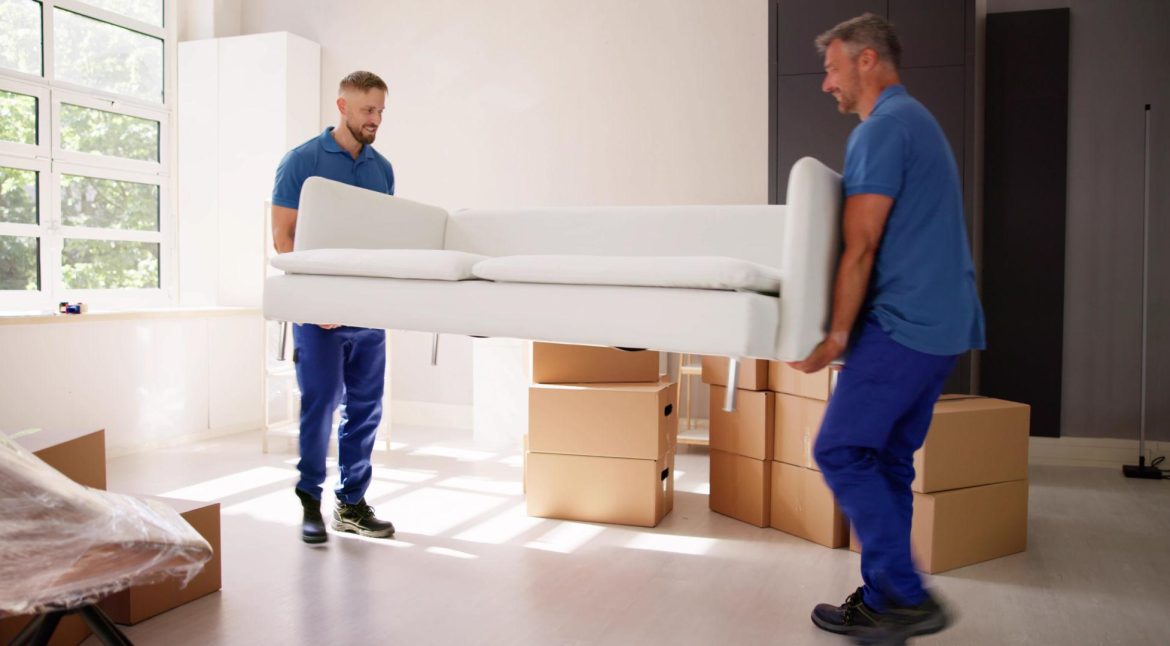 Stacked cardboard moving boxes and packing materials ready for relocation