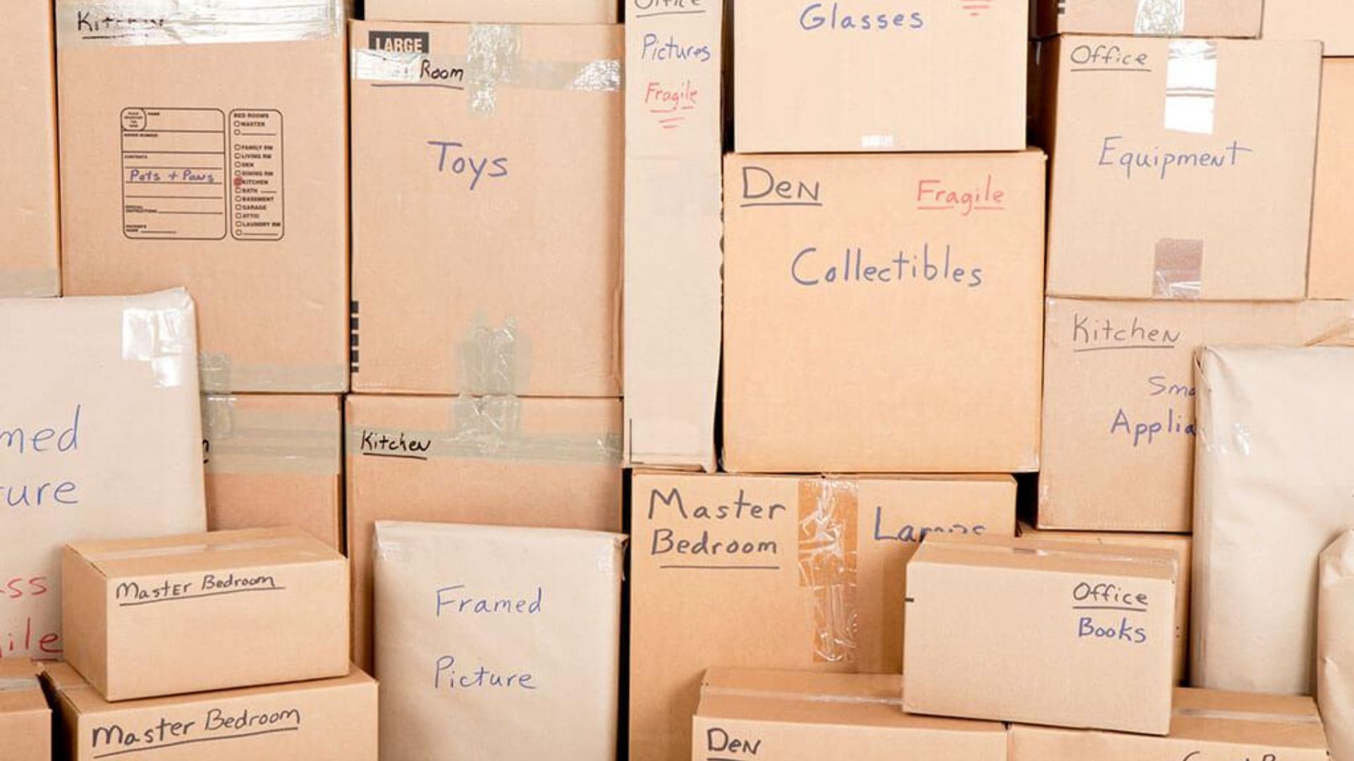 Moving boxes bubble wrap packing tape and protective materials arranged for packing