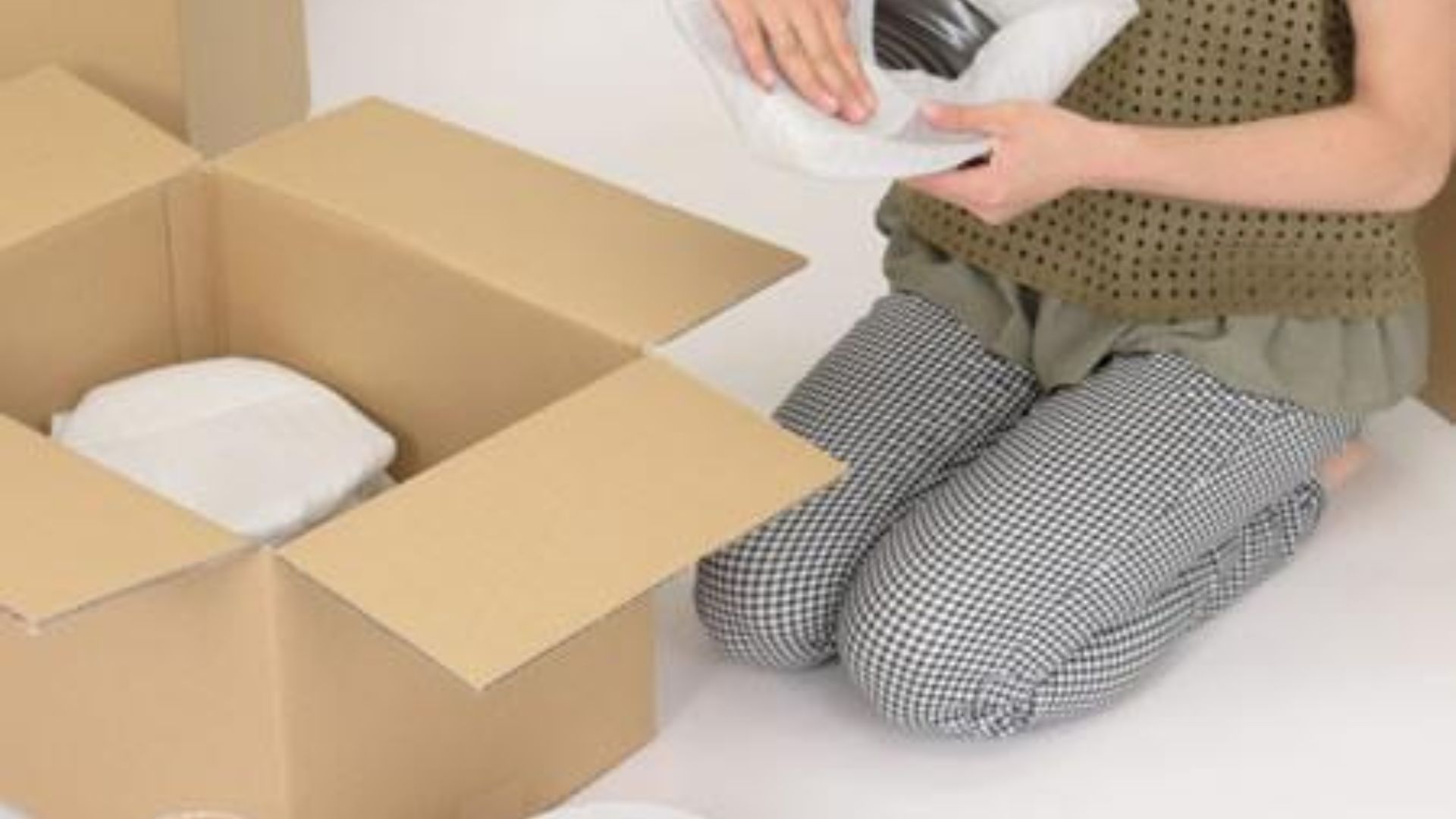 Glassware wrapped individually with packing paper and bubble wrap for protection