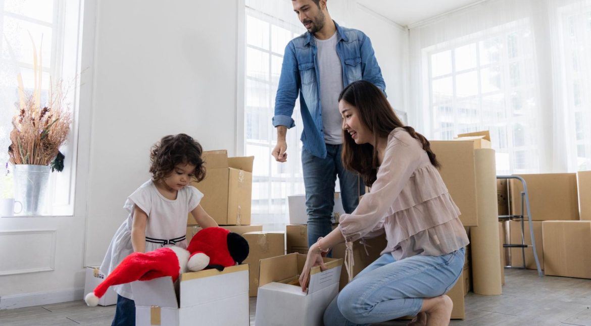 Bedroom belongings packed neatly into labeled moving boxes