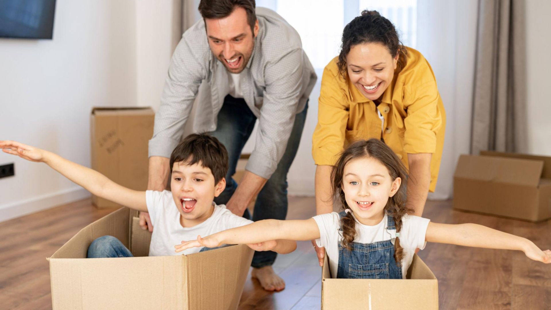 Happy family settling into a new home after completing a long-distance move