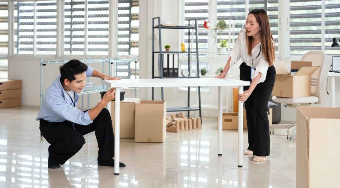 Business owner reviewing office relocation costs and moving plans before an office move