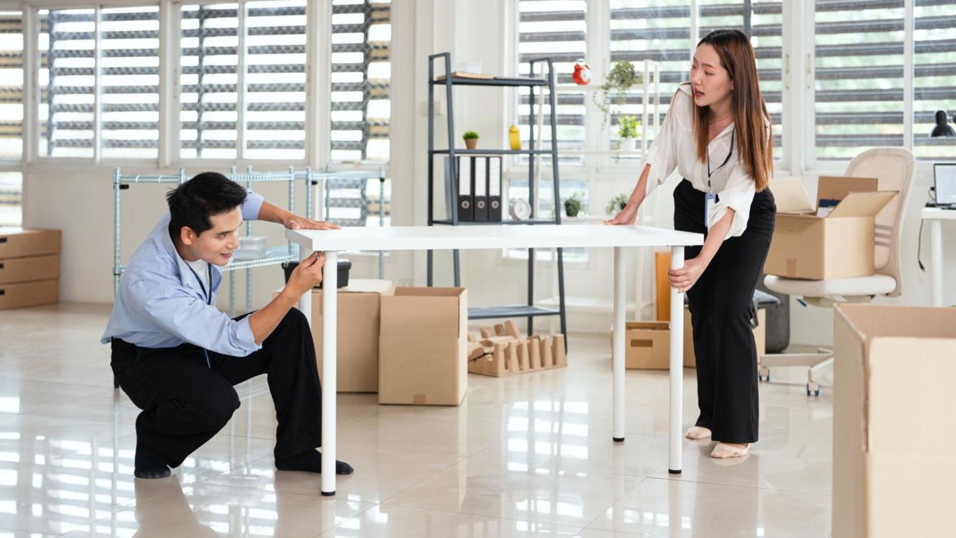 Business owner reviewing office relocation costs and moving plans before an office move