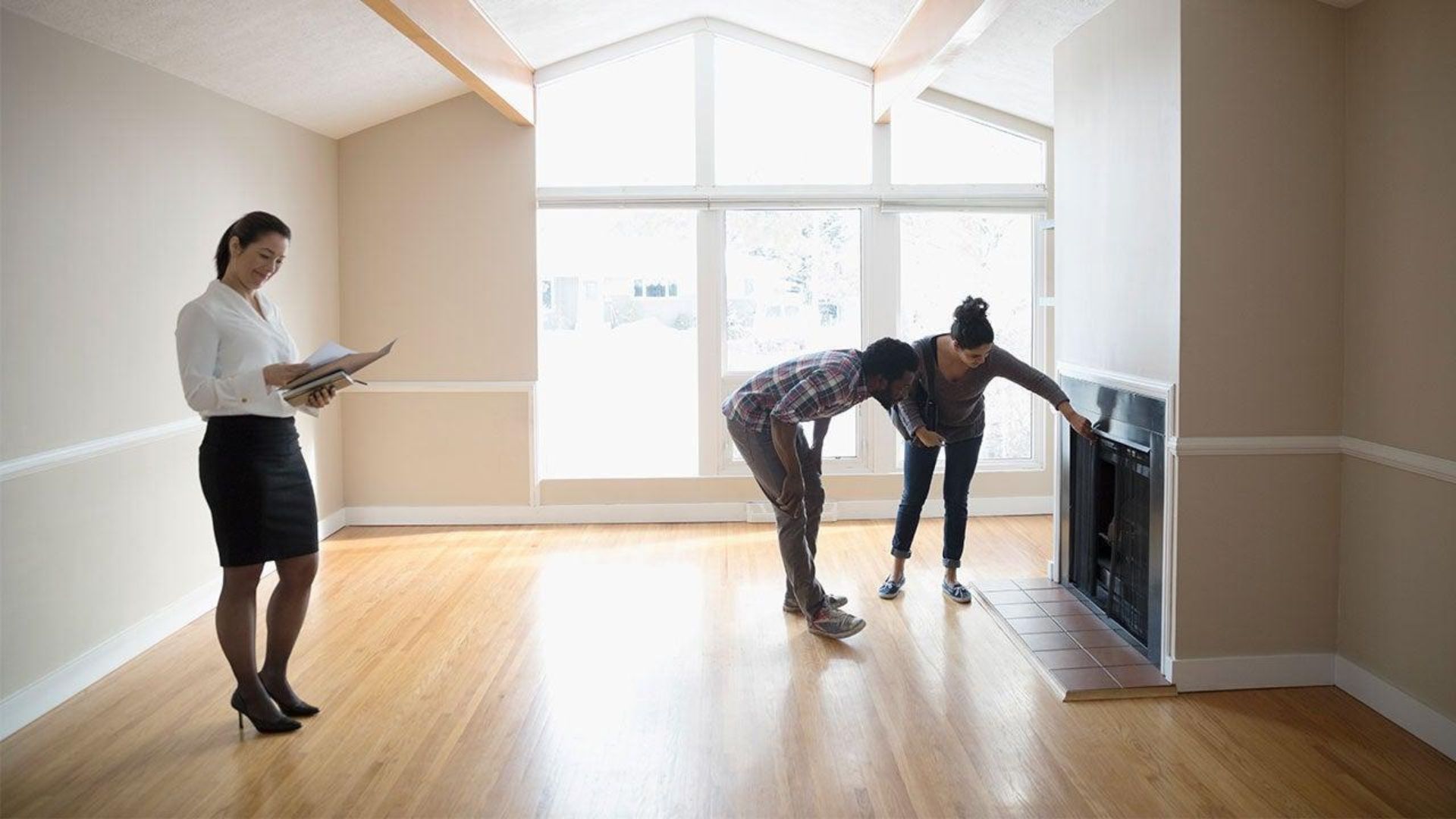Homeowner inspecting empty rooms and closets before leaving the property