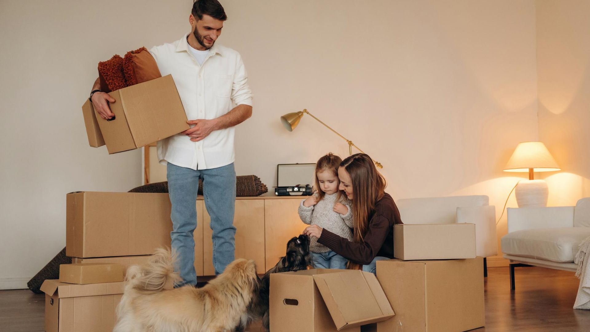 Family sorting household belongings into keep donate and discard categories