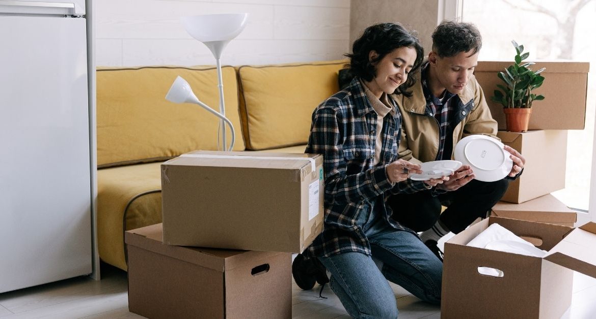 Homeowners reviewing moving estimates and relocation expenses while planning a long-distance move from Florida