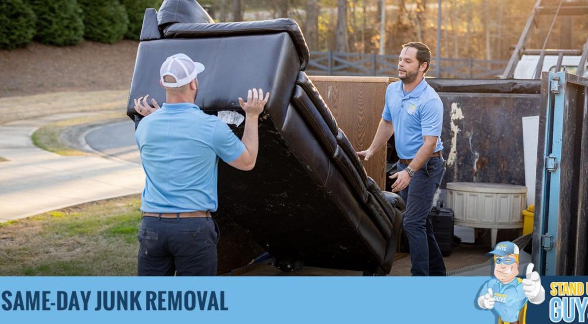 Junk removal specialist evaluating the volume of items for disposal