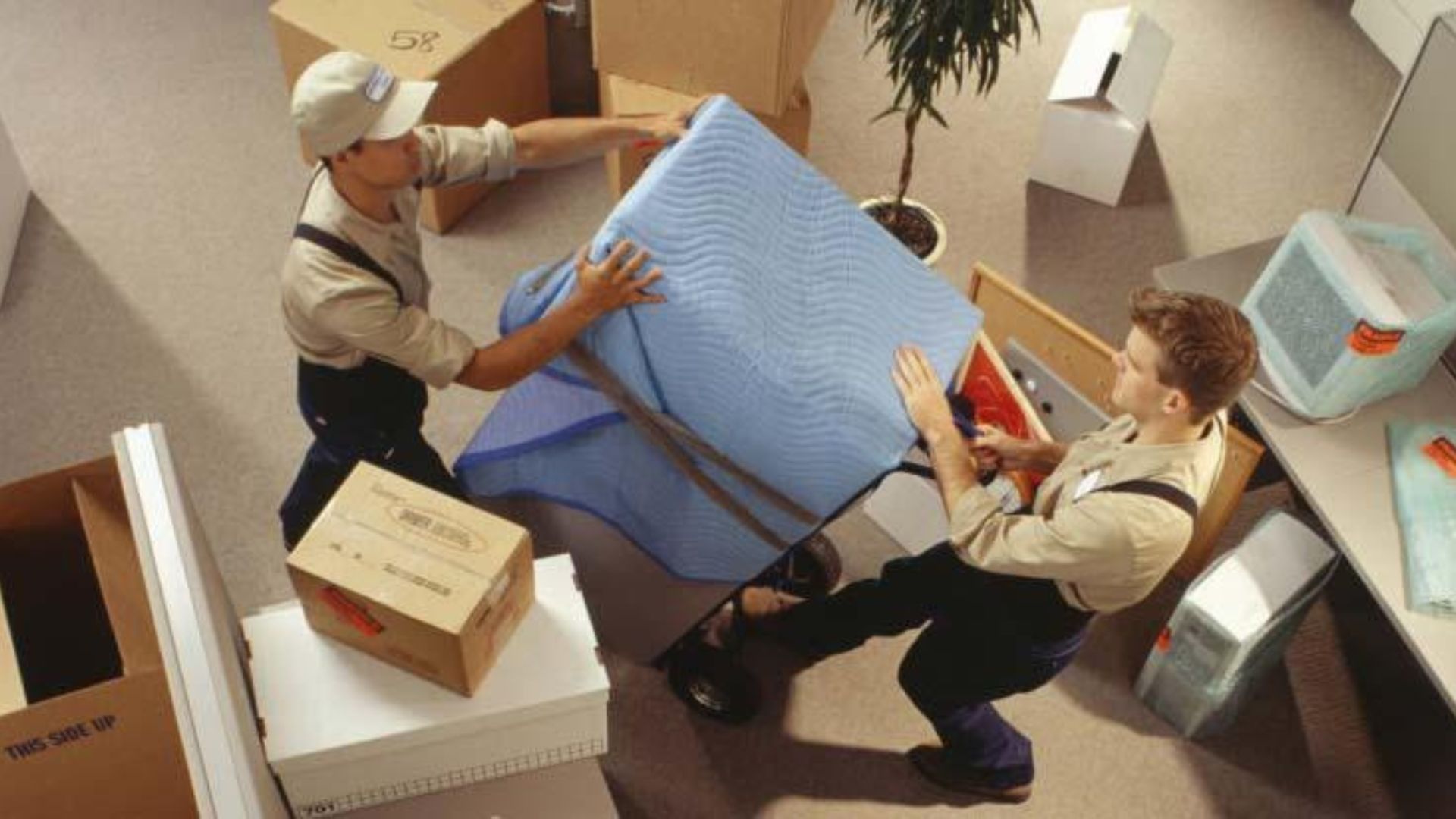 Business team reviewing office furniture equipment and inventory before relocation