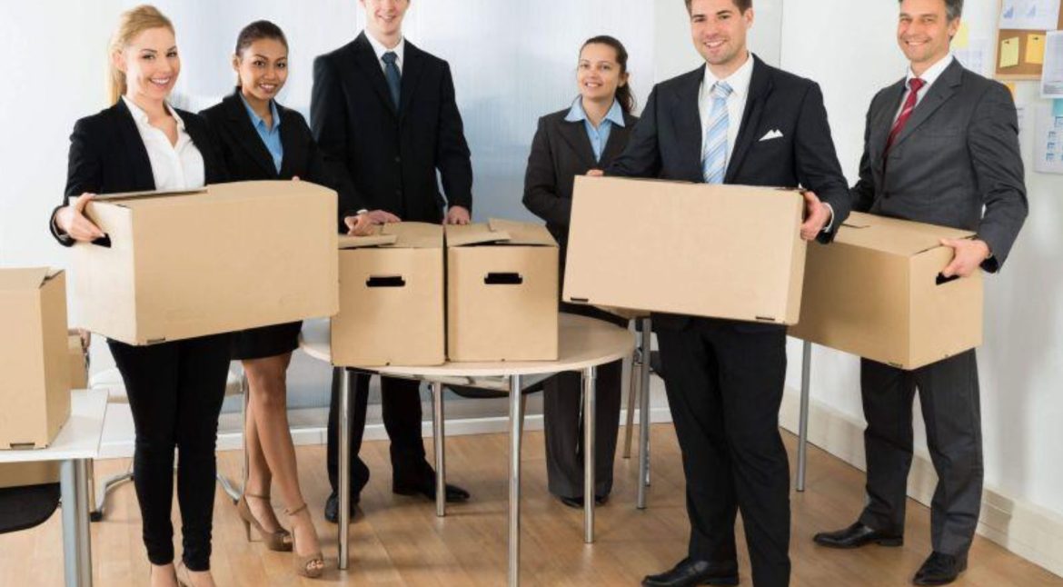 IT professionals documenting computers servers and network equipment before an office move