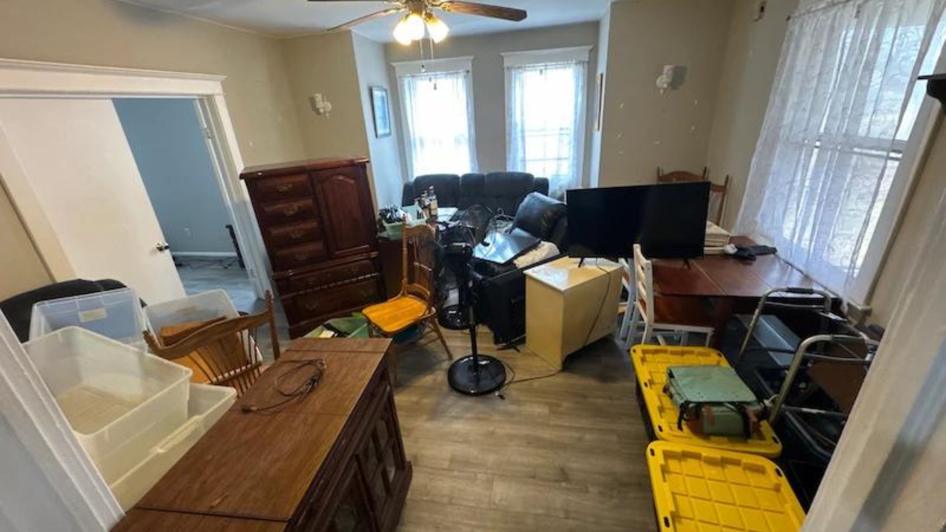 Professional junk removal team clearing unwanted household items from a residential property