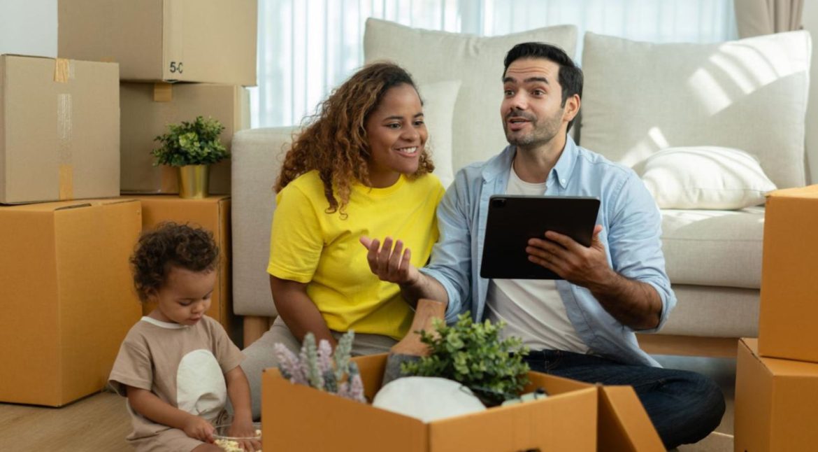 Family reviewing moving plans and relocation documents before an interstate move