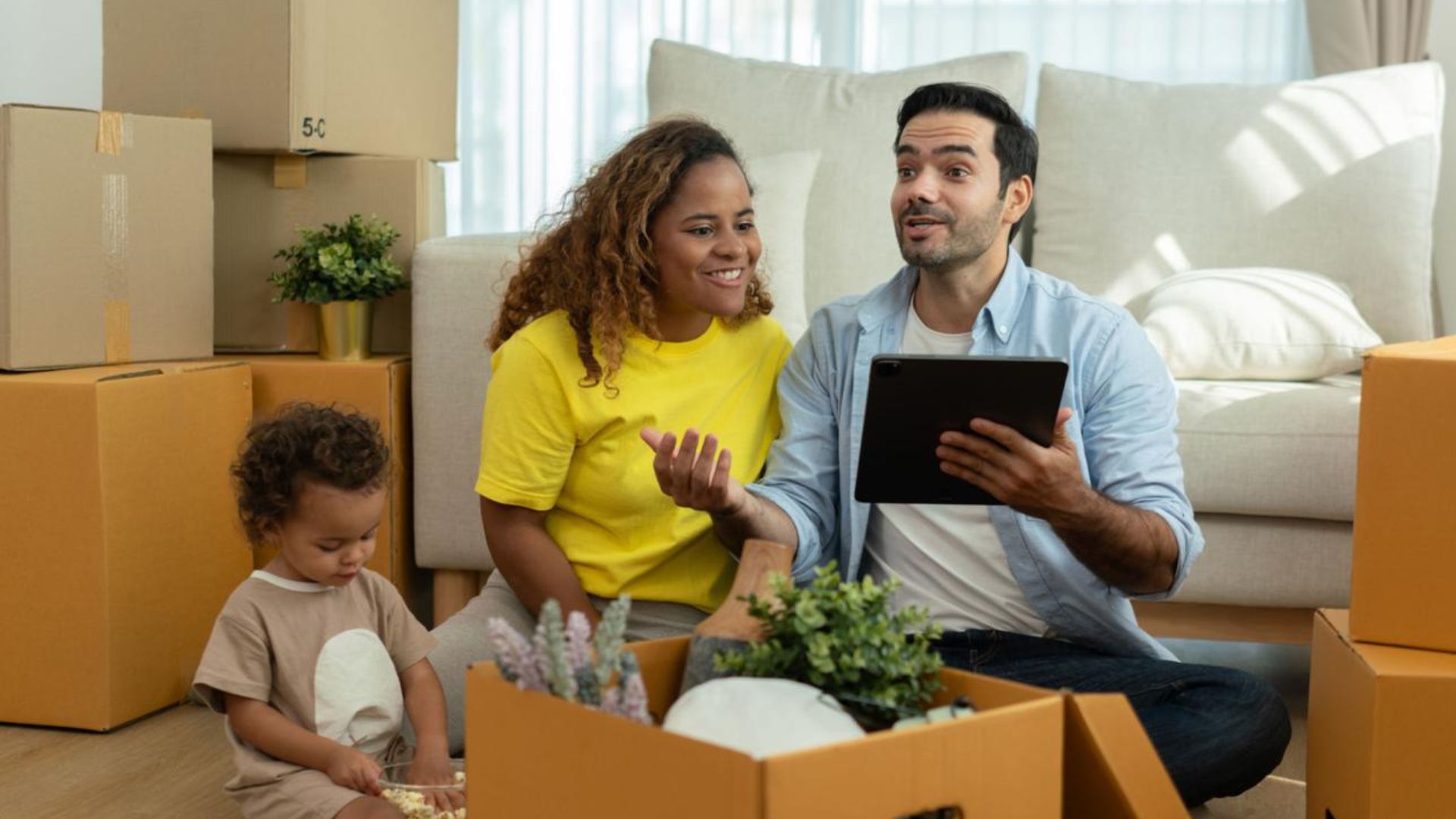 Family reviewing moving plans and relocation documents before an interstate move