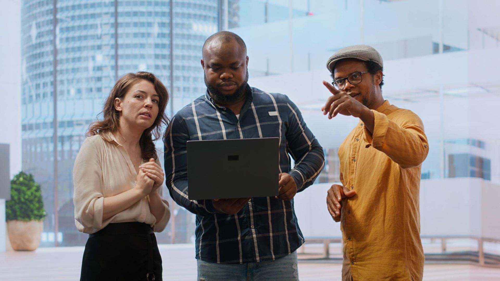 Office employees reviewing relocation updates and workspace assignments