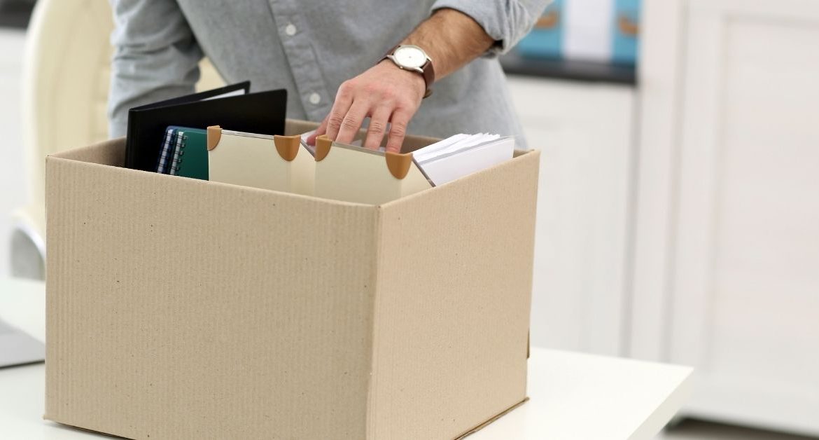 Important moving documents including passports insurance records and contracts organized in a secure folder